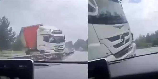 Kar�� �eride ge�ip, i�erisinde yolculuk yapt��� otomobile �arpan TIR'� cep telefonuyla g�r�nt�ledi