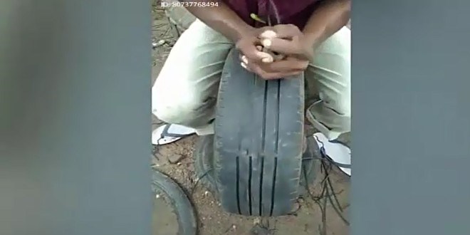 Y�pranm�� lastikleri kendi y�ntemiyle yenileyen adam